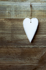 Heart shaped decoration over weathered wood
