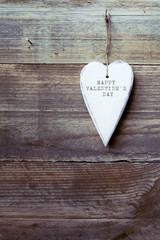 Heart shaped decoration over weathered wood