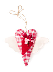 Textile heart with key on a white background. Handwork
