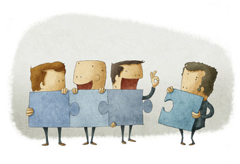People holding pieces of a jigsaw