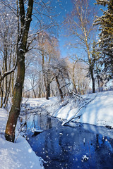 Winter landscape with the river in frosty sunny day