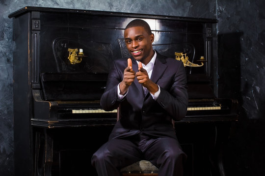 Black man near the piano