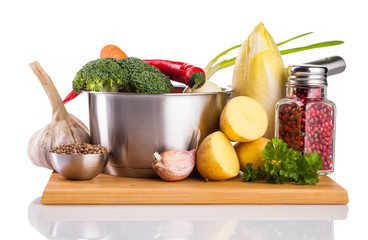 vegetables and stainless pot isolated on white