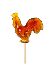 Russian lollipop in the form of rooster on white background