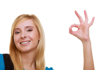 Casual girl female student with bag backpack showing OK isolated