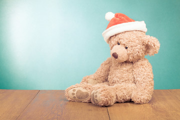 Teddy Bear in Santa hat for new year greeting card