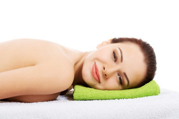 Obraz premium Beautiful woman lying at spa salon.