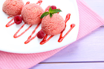 Delicious ice cream on plate on table close-up
