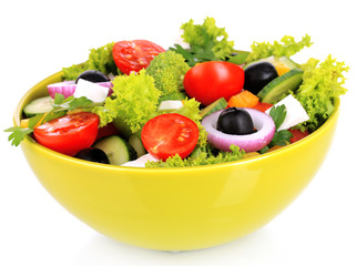Greek salad on plate isolated on white