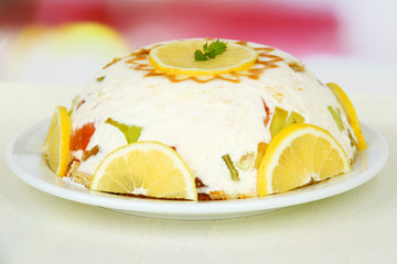 Delicious jelly cake on table on light background