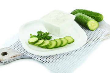 Cucumber yogurt in bowl, on white, isolated on white