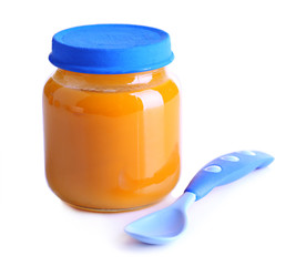 Baby food in glass jar, isolated on white