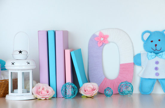 Shelf decorated with handmade knit letter