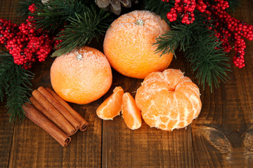 Christmas composition with frosted ripe tangerines