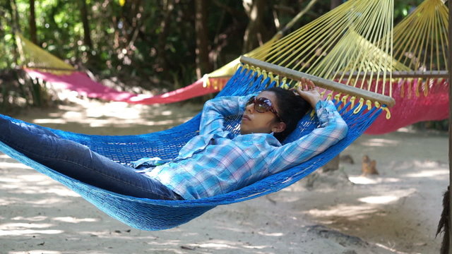 Woman relaxing in a Hammock
