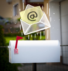 Envelope with email sign dropping into mailbox
