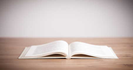 Open book on wooden deck