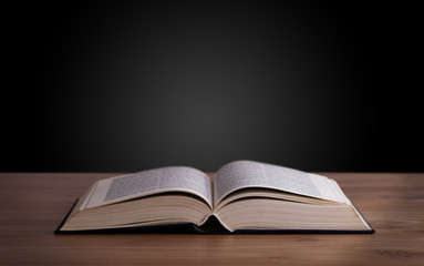 Open book on wooden deck