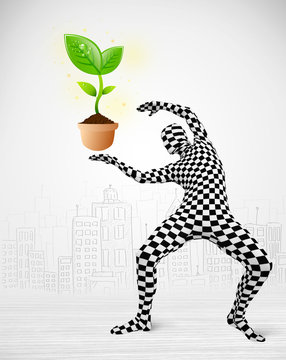 man in full body suit with eco plant