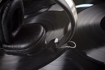 Headphones with vinyl records background