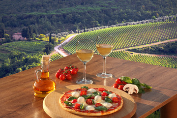 Italian pizza and glasses of white wine in Chianti, Italy © Tomas Marek