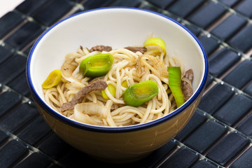 Asian noodles with beef meat and leek