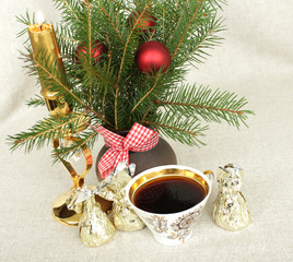 Obraz na płótnie Canvas Cup of coffee with chocolates and a bouquet of New Year