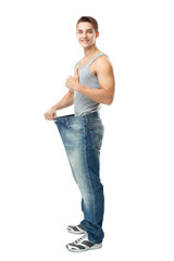 Man showing how much weight he lost