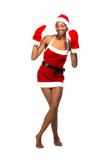 Christmas afro american woman wearing a santa hat smiling
