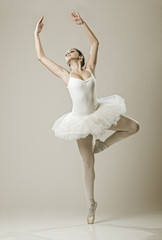 Fototapeta na wymiar Portrait of the ballerina in ballet pose