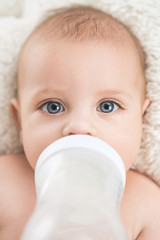 Cute little baby drinking milk