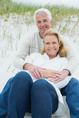 Romantic senior couple relaxing at beach