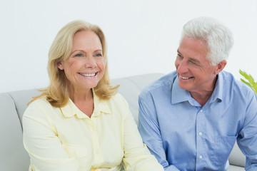 Happy relaxed senior couple at home