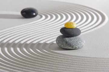 Japan zen garden with stones in raked sand