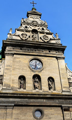 Ornate front facade of an old stone church