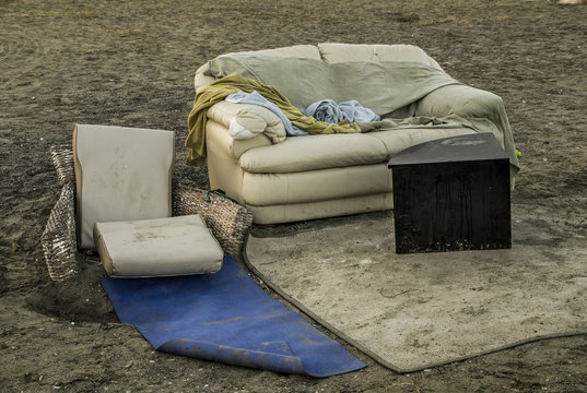 Homeless furniture on the evening beach
