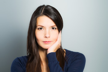 Thoughtful attractive woman with a serene face