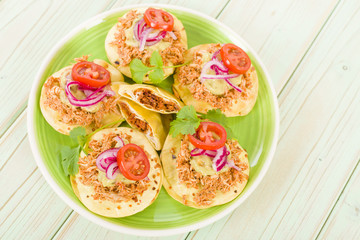 Panuchos - Mexican corn tortillas filled with refried beans