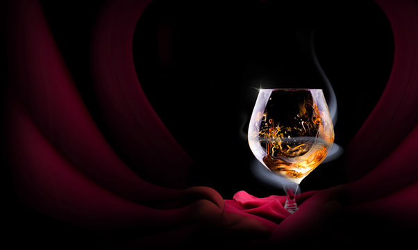 Cognac glass shrouded in a smoke