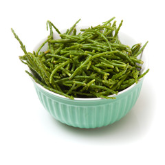 Bowl of Samphire isolated on a white studio background.