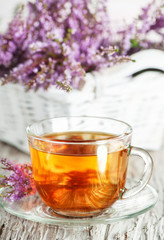 Cup of tea and branch of heather