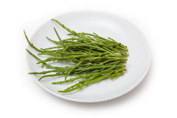 Plate of Samphire isolated on a white studio background.