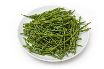 Plate of Samphire isolated on a white studio background.
