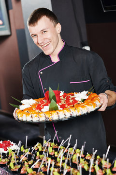 chef with food on plates