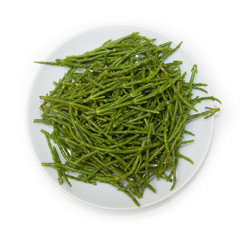 Plate of Samphire isolated on a white studio background.