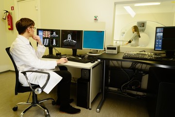 Doctor with woman patient  at the computed tomography