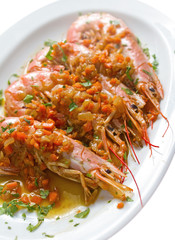 Diagonal grilled shrimp shot on white background. Very rich