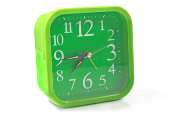 Green clock on white