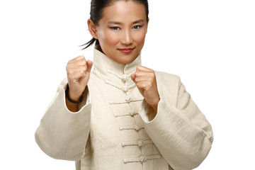 Beautiful asian woman make kung fu gesture