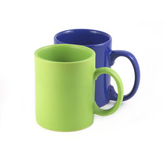 Green and Navy blue empty tea or coffee cups isolated closeup